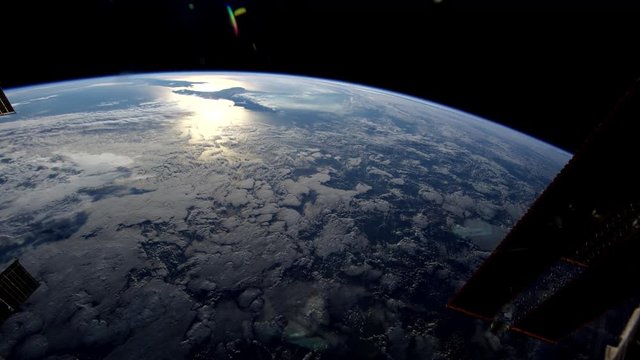 Beauty shot timelapse, space station flies over Earth ocean