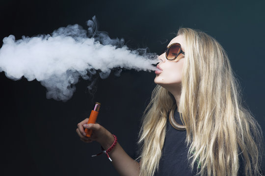 young female vaping electronic cigarette