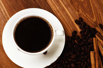 Cup of coffee and roasted coffee beans