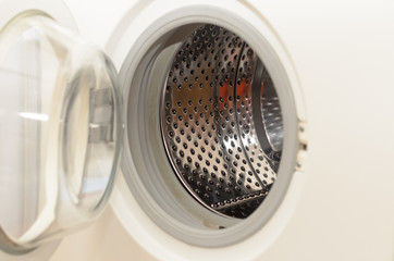Washing dirty clothes in an automatic washing machine.