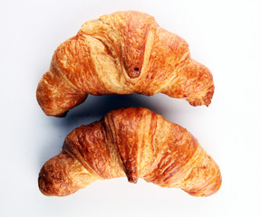 freshly baked croissants on white board, bakery concept