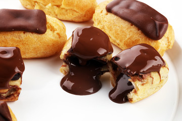 Traditional French dessert. Eclair with chocolate icing. Pastery concept
