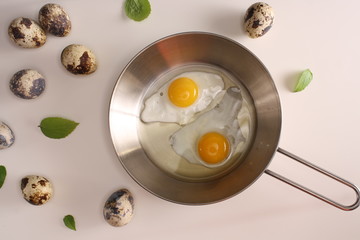 Fried eggs quail egg on a white background