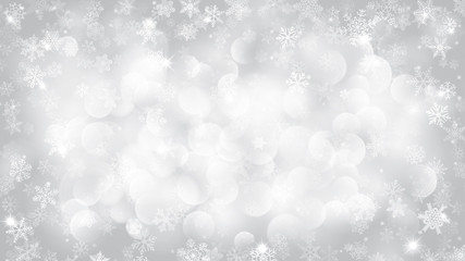 Christmas background of snowflakes with bokeh effect in white