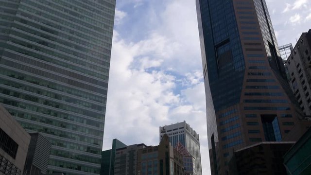 day singapore famous raffles place entrance downtown crowded center panorama 4k

