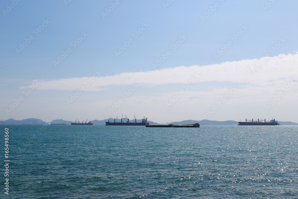 Wall mural Cargo ship floating in the sea of sriracha city.