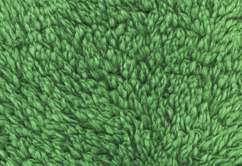 Green double sided terry towelling fabric texture background. High resolution