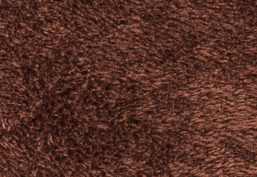 Double sided terry towelling fabric texture background. Brown color