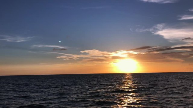 Blue sky with yellow sunset over the Caribbean Sea.