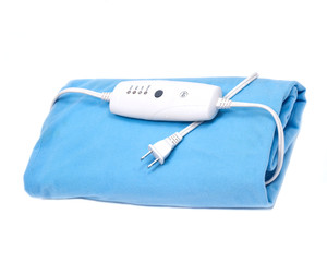 Blue electric heating pad isolated on white background © bjphotographs