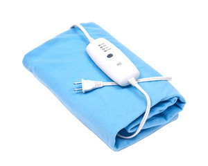 Blue electric heating pad isolated on white background © bjphotographs