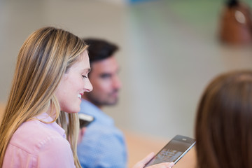 Young Woman Working on Tablet in Class
