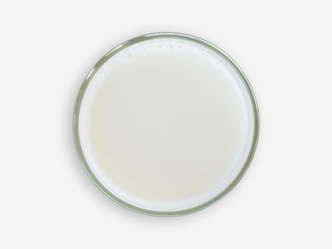 Top view of milk glass on white