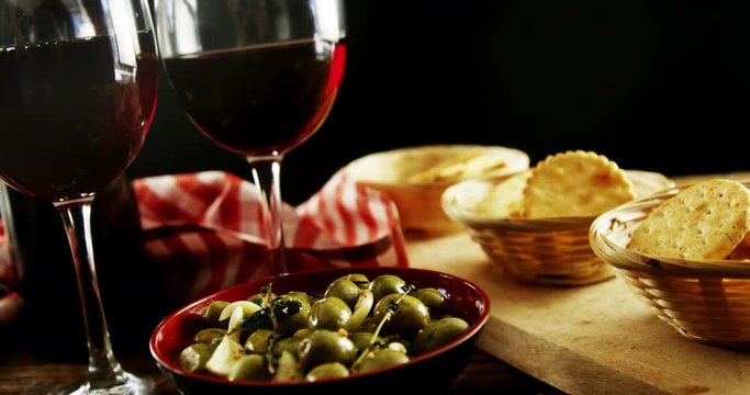 Red wine served with olive tapas and crackers