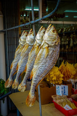 Fresh fish over a newspaper in a market in fishermen town in lantau, Hong Kong, China