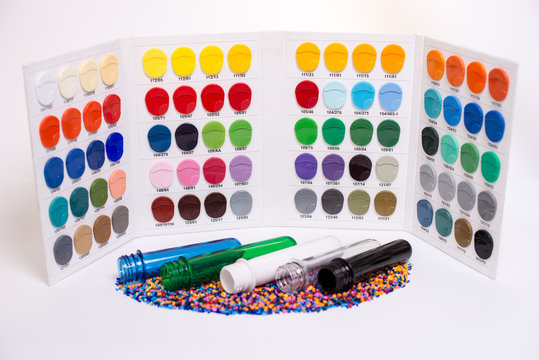 Clear PET Preforms on white background for presentation. Preforms and raw materials of different colors With the Color Picker