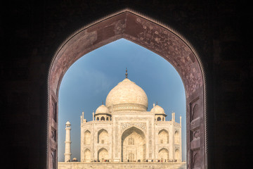 Fototapeta na wymiar View of Taj Mahal with pool reflection in Agra India at sunrise.