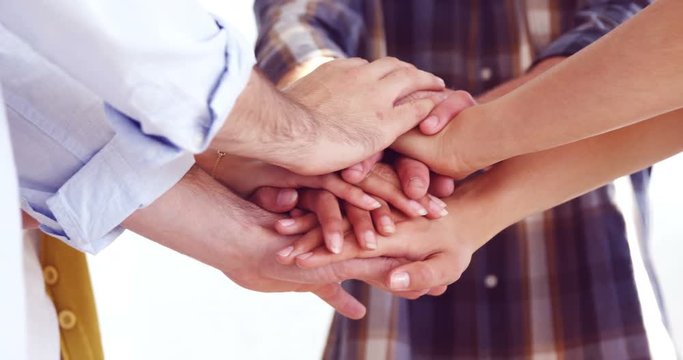 Happy executives forming handstack