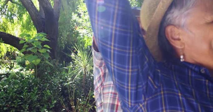 Senior couple dancing in the garden