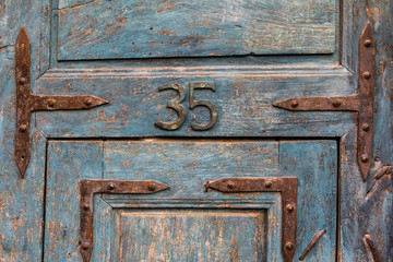 Old vintage blue door number with number 35, San Miguel De Allende, Mexico