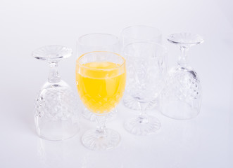 Orange juice in glasses on white background.