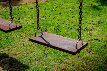 Wooden swing in the park