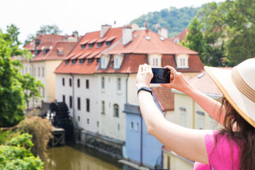 Female tourist taking a photo with mobile phone
