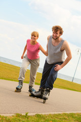 Fototapeta premium roller skater couple skating outdoor