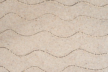 wave pattern drawing in sand