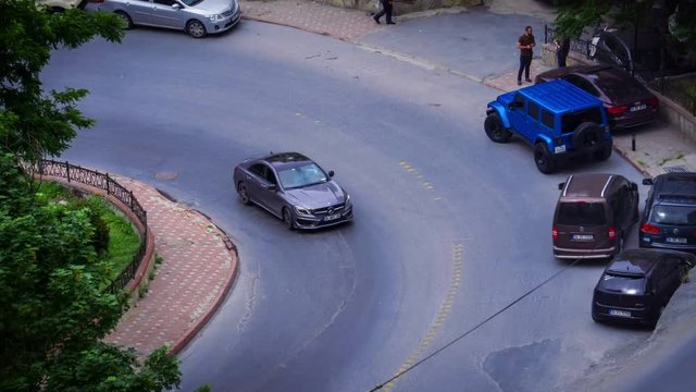 Curvy and Winding Road with Color Vehicles