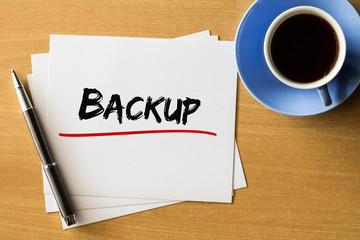 Backup - handwriting on papers with cup of coffee and pen, business concept
