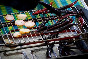 Grilling dried chillies and galangal