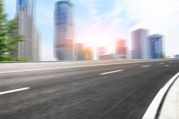 Fototapeta premium Motion blur asphalt road and modern buildings in shanghai