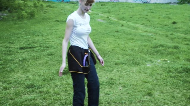 Woman playing with her border collie dog, throwing the frisbee 4k