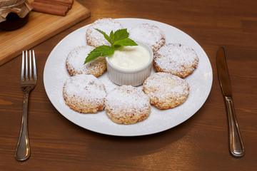 Cottage cheese pancakes or fritters. Traditional Russian and Ukrainian cuisine