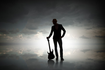 Obraz premium Rock guy with guitar. Mixed media