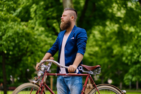 Close up image of a man on a retro bicycle.