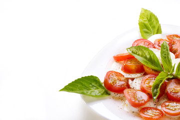Caprese salad on white table