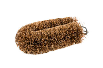 Cleaning brush made from coconut husk over white background