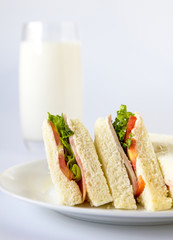 Sandwich and milk glass.