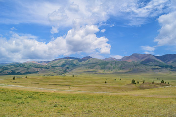 Landscape of Kurai steppe and hills in Altai mountains. Altay Republic, Siberia, Russia.