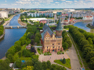 Obraz premium Aerial cityscape of Kant Island in Kaliningrad, Russia at sunny summer day with white clouds in the blue sky