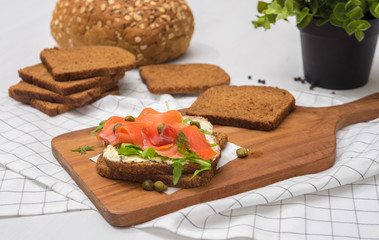Salmon Sandwich on wooden plate
