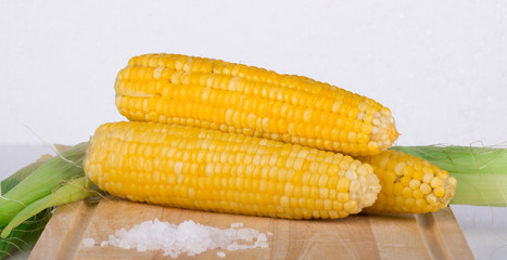 Sweet corn on a wooden table
