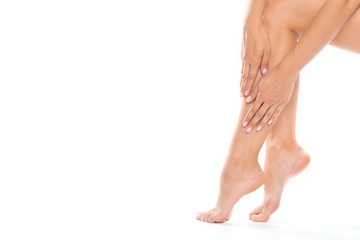 Beautiful women feet isolated on white close-up