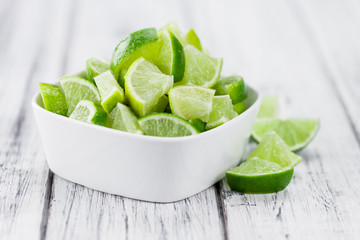 Wooden table with Lime Slices (selective focus)