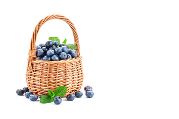Basket with blueberries isolated on white background.