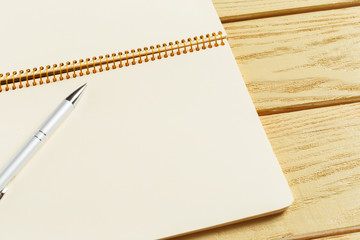 open notepad on wooden background