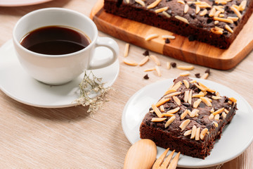 Delicious homemade assorted chewy chocolate fudge brownies with mixed nuts (almond, cashew, macadamia) on baking tray - food photography