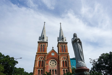 Notre Dame Cathedral (Vietnamese: Nha Tho Duc Ba) in a beautiful weather, build in 1883 in Ho Chi Minh city, Vietnam. HOCHIMINH CITY (SAI GON), VIET NAM - July 11, 2017